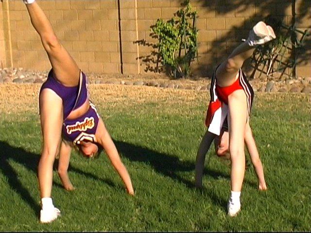 Pictures of cheerleaders doing their moves outside #60578265