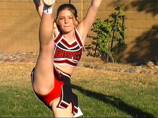 Pictures of cheerleaders doing their moves outside #60578379