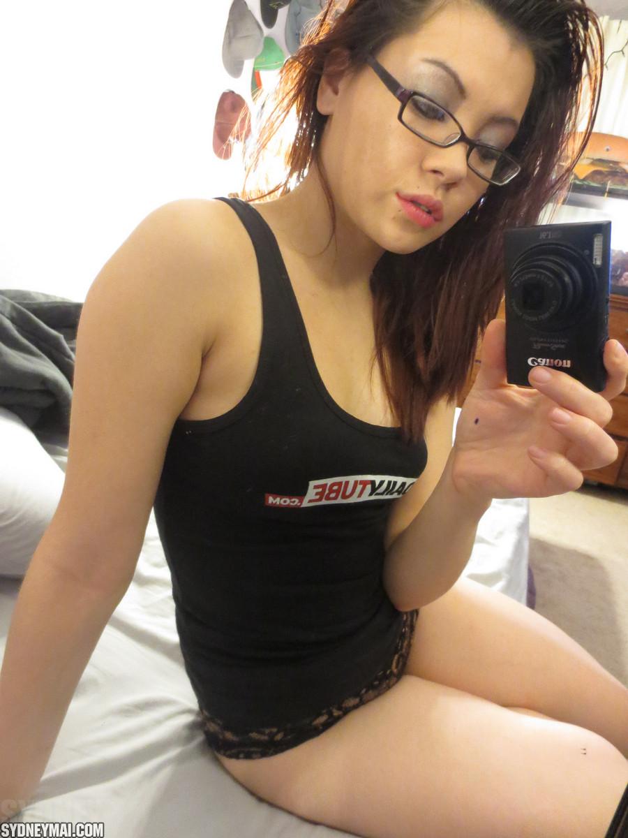 Asian coed Sydney Mai teases in her black tank top #60041450