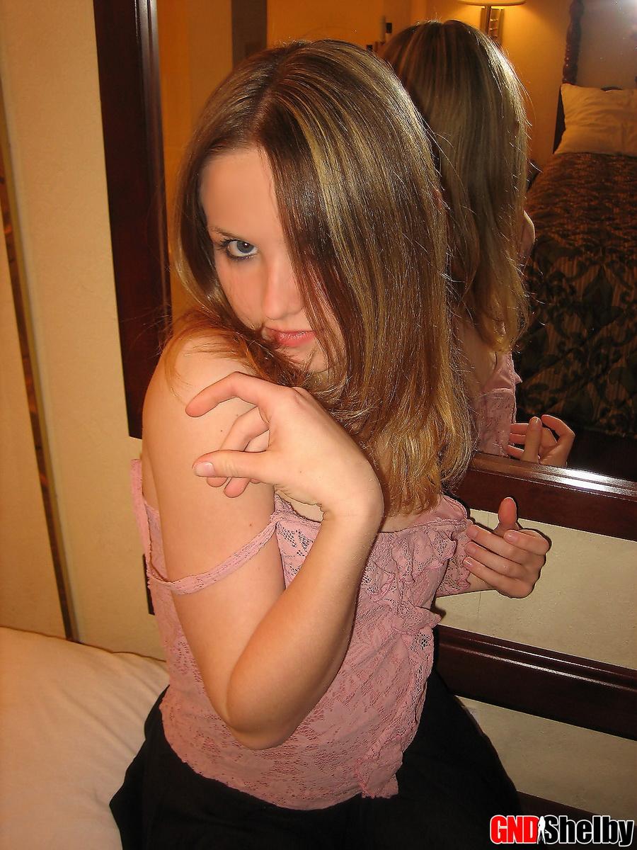 Petite teen Shelby strips naked in front of her hotel mirror and begins to finger her tight little pussy #58761745