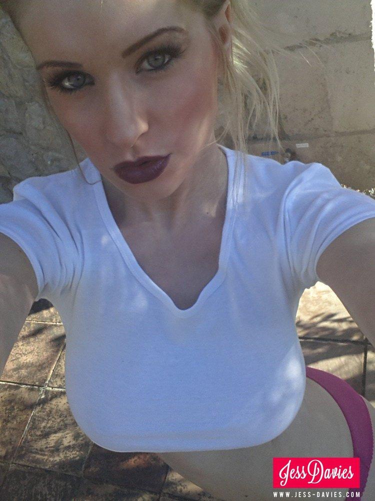 Jess Davies pulls up her tight white top to reveal her beautiful breasts #55394082