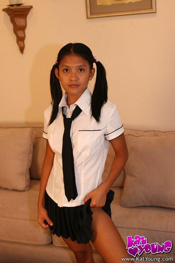 Kat Young strips wearing a school girl uniform #58043317