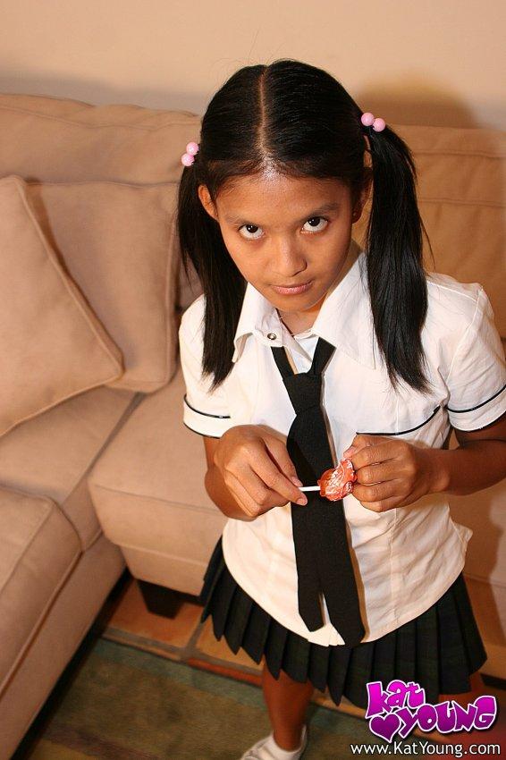 Kat Young strips wearing a school girl uniform #58043624