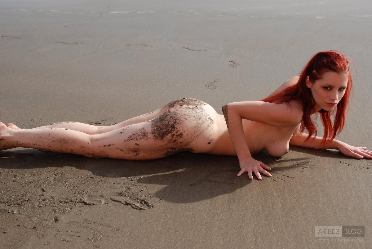 Pictures of teen girl Ariel rolling around on a beach #53293029