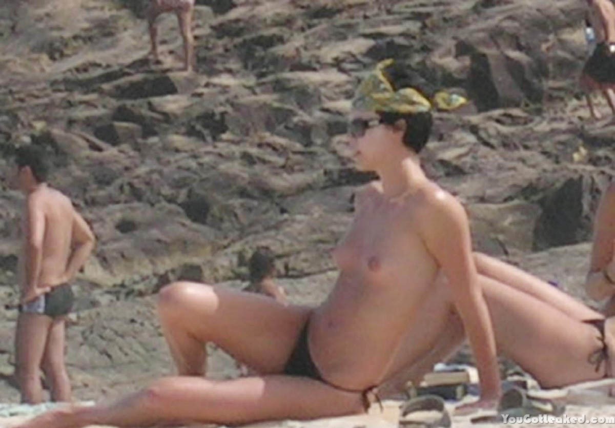 Charlize Theron topless on a beach #79516360