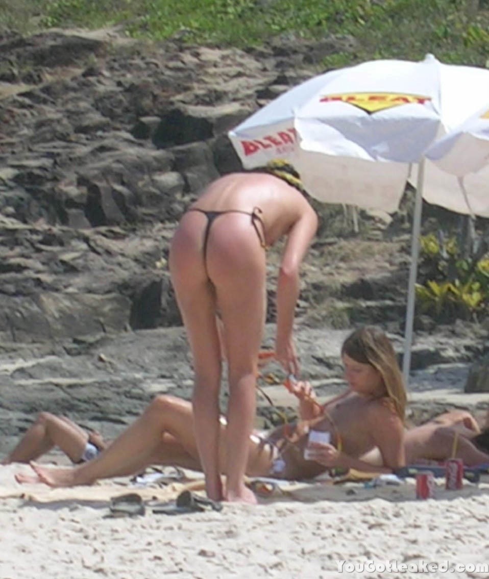 Charlize Theron topless on a beach #79516361